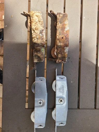Old corroded roller next to a new replacement roller